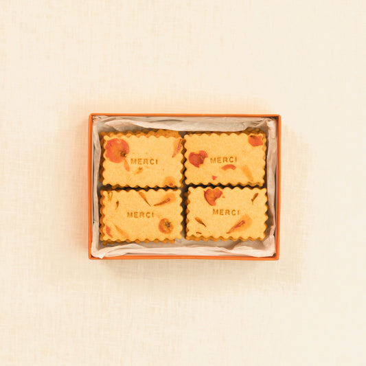 La boite de Providencia marque de biscuits personnalisés ouverte avec biscuits Merci